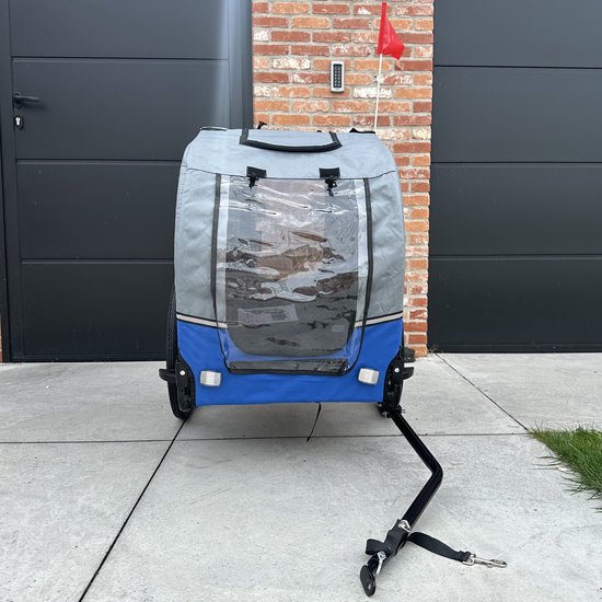 Hondenfietskar in blauw en grijs, de achterkant met reflectoren en een transparant raam.