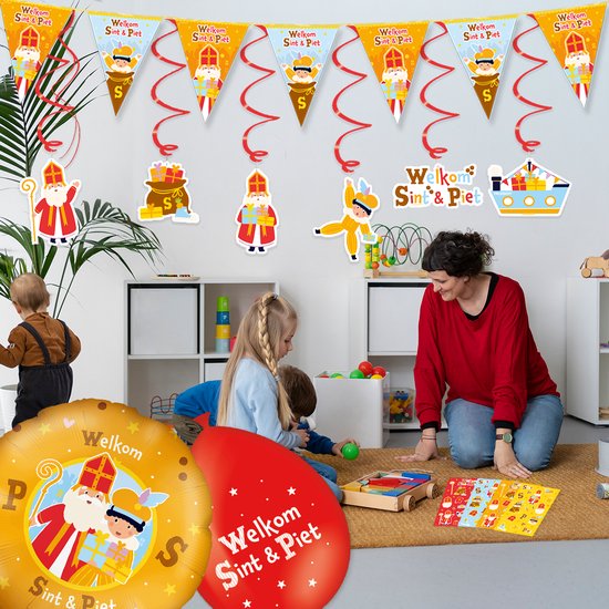 Kinderen en een volwassene vieren Sinterklaas met decoraties, ballonnen en spelletjes.