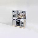 Grijze Miele speelgoedkeuken met koelkast, magnetron, oven, kookplaat, gootsteen en diverse accessoires.