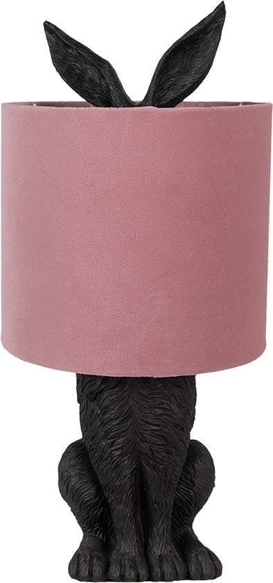 Lampe lapin noire avec un abat-jour rose, les oreilles de lapin dépassent de l'abat-jour.