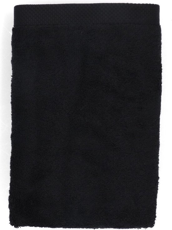 Zwarte badhanddoek van Lasa Home met een gebreide rand aan de bovenzijde.