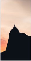 WallClassics - Poster Glanzend – Silhouet van Jezusbeeld op berg met Zonsondergang - 50x100 cm Foto op Posterpapier met Glanzende Afwerking