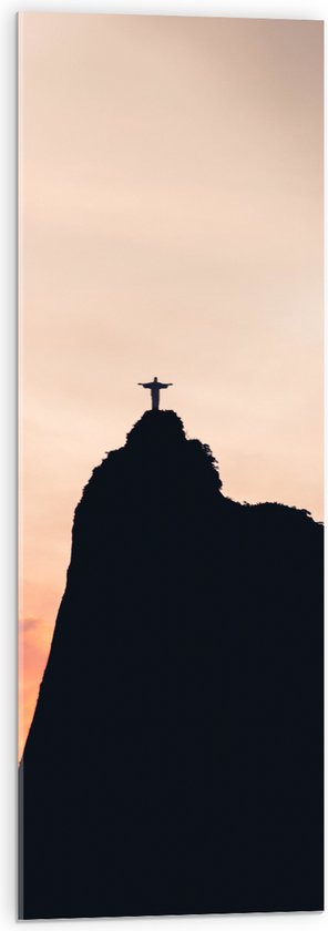 WallClassics - Acrylglas - Silhouet van Jezusbeeld op berg met Zonsondergang - 30x90 cm Foto op Acrylglas (Met Ophangsysteem)