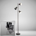 Zwarte staande lamp met drie verstelbare spots en een ronde voet. Close-up van de verstelbare spot.
