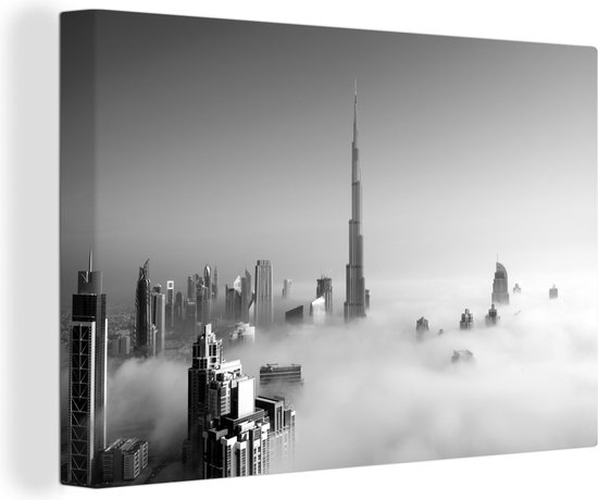 Canvas Schilderij Mistige ochtend onder de Burj Khalifa in Dubai - zwart wit - 120x80 cm - Wanddecoratie