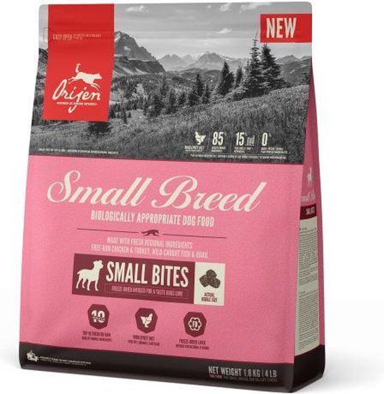 Orijen Small Breed hondenvoerzak, roze met landschap en honden. Vermelding 'Small Bites'.