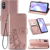 Voor Xiaomi Redmi 9A Vierbladige sluiting Reliëfgesp Horizontale flip TPU + PU lederen tas met lanyard & kaartsleuf & portemonnee & houder (roségoud)