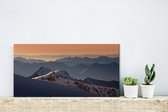 Canvas Schilderij Zonsondergang bij de berg Schilthorn in Zwitserland - 40x20 cm - Wanddecoratie