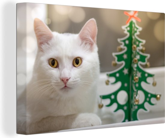 Canvas Schilderijen - Witte kat ligt naast een papieren kerstboom - Wanddecoratie