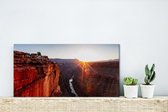 Canvas Schilderij Zonnestralen boven een berglandschap en de Colorado rivier in de Verenigde Staten - 40x20 cm - Wanddecoratie
