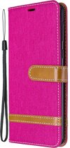 Mobigear Telefoonhoesje geschikt voor Samsung Galaxy A21 Hoesje Stof | Mobigear Fabric Bookcase Portemonnee | Pasjeshouder voor 2 Pasjes | Telefoonhoesje voor Pinpas / OV Kaart / Rijbewijs - Magenta