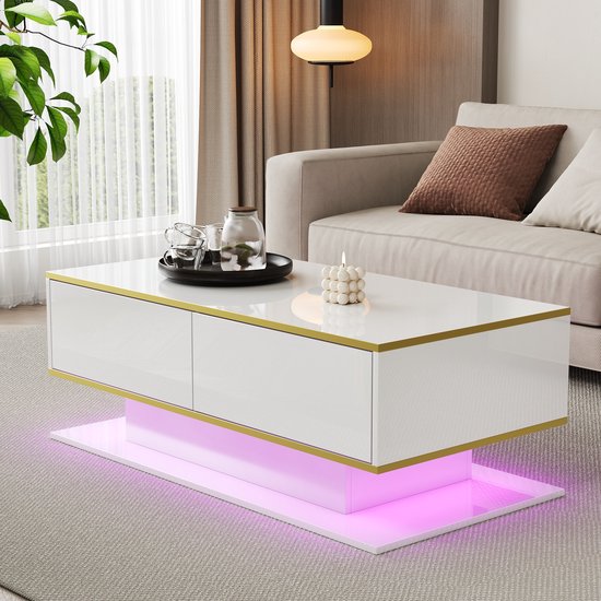 Moderne witte salontafel met gouden randen en LED-verlichting in roze tint.