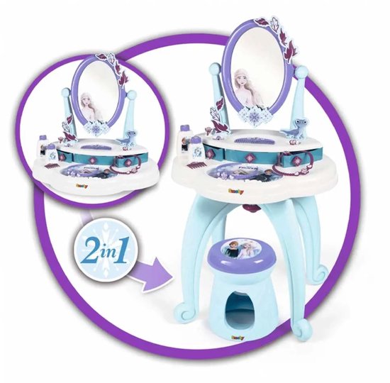 Een witte speelgoedkaptafel met blauw krukje, spiegel met Frozen-decoratie. Een cirkel toont '2-in-1'.