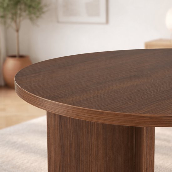 Ronde donkerhouten tafelblad met zichtbare houtnerf.