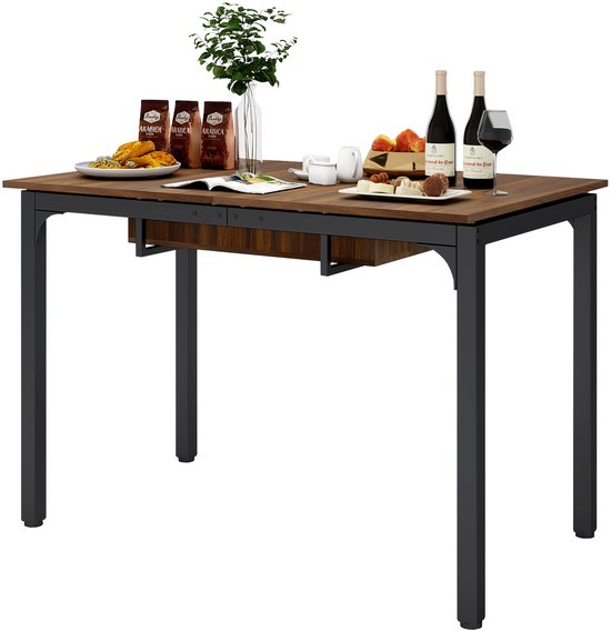Eettafel met walnoothouten blad en zwart metalen frame, gedecoreerd met eten, drankjes en plant.