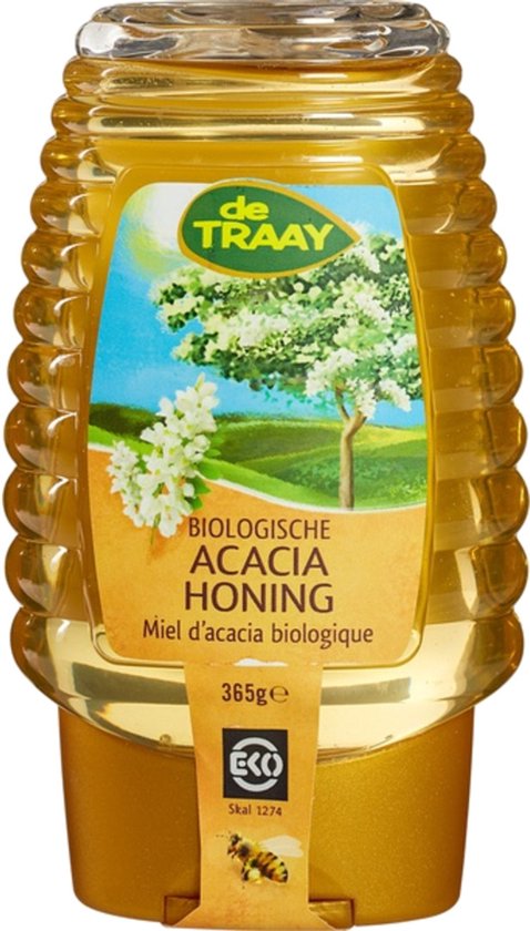 Gele fles honing met een geel label met een acacia boom en witte bloesems. De tekst luidt 'Biologische Acacia Honing' en een bij.