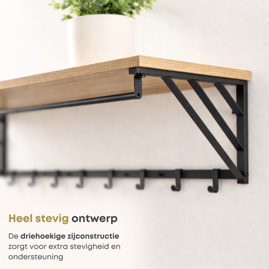 Detail van een stevige wandkapstok met driehoekige zijconstructie en houten plank.