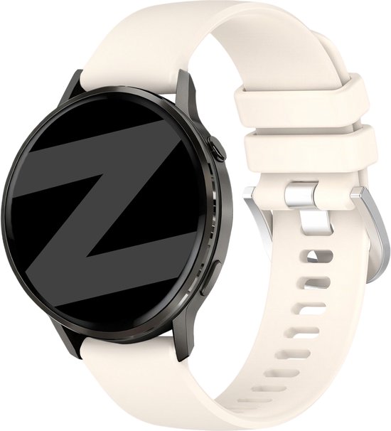 Zijaanzicht van een smartwatch met zwart metalen frame en een wit siliconen bandje met metalen gesp.