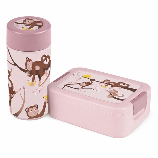 Boîte à lunch et gobelet rose avec une image de singes espiègles dans des arbres avec des bananes.