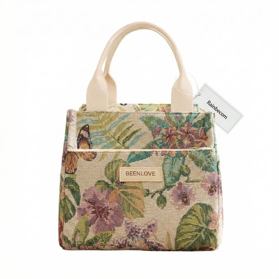 Sac à lunch à imprimé floral et feuillage tropical, beige avec des fleurs pastel et des feuilles vertes. Poignées crème.