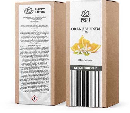 Doos met een fles oranjebloesemolie en etiket met sinaasappelschijfjes en bloesems.
