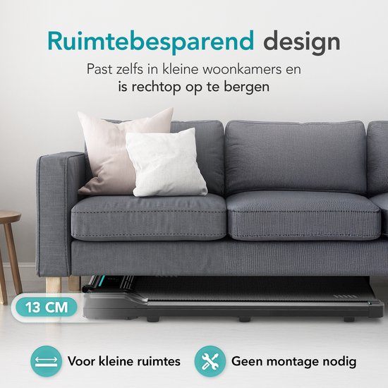 Zwarte loopband van 13 cm hoog onder een grijze bank. "Ruimtebesparend design".