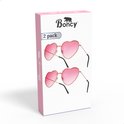 Boncy 2-pack roze hartvormige zonnebrillen op de verpakking, met gouden montuur.
