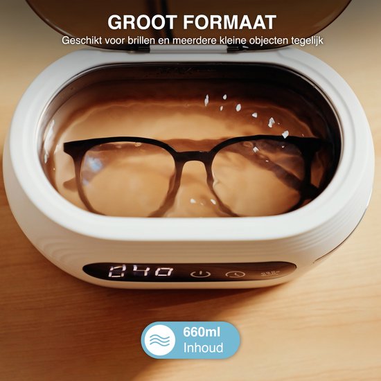 Witte ultrasone reiniger met een bril erin, met een capaciteit van 660ml.