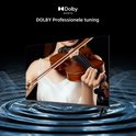 CHiQ TV met een vrouw die viool speelt op het scherm en "DOLBY AUDIO" logo met "DOLBY Professionele tuning".