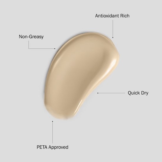 Lichtbruine veeg bronzer met de tekst 'Antioxidant Rich', 'Quick Dry', 'Non-Greasy', 'PETA Approved'.