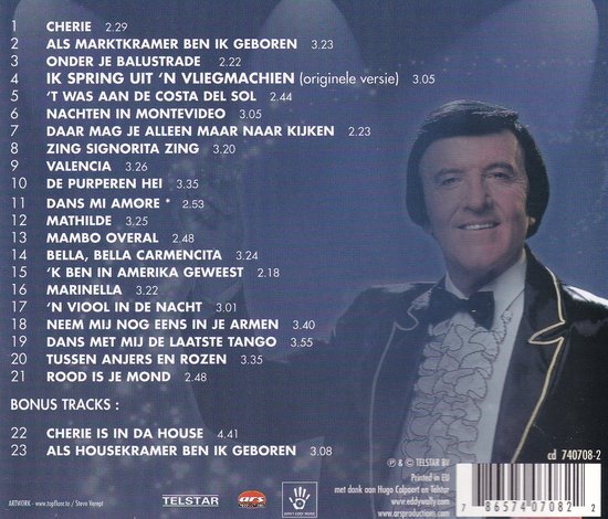 Eddy Wally in zwart pak met strik en ruches, zingt.