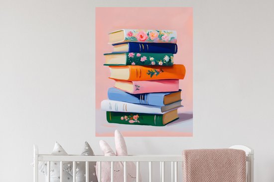 Een stapel kleurrijke boeken met bloemenprints op een roze achtergrond.