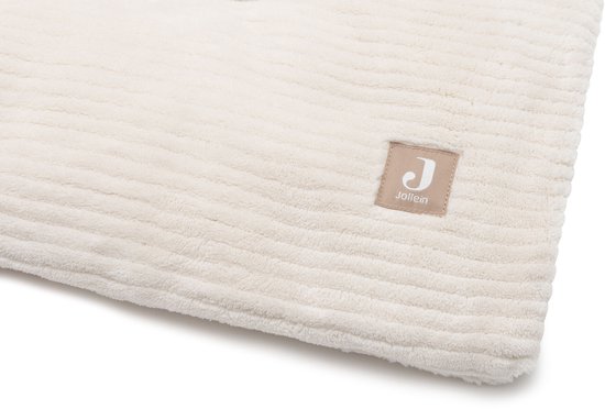 Crèmekleurig boxkleed met fijne ribbels en een beige label met het Jollein logo.