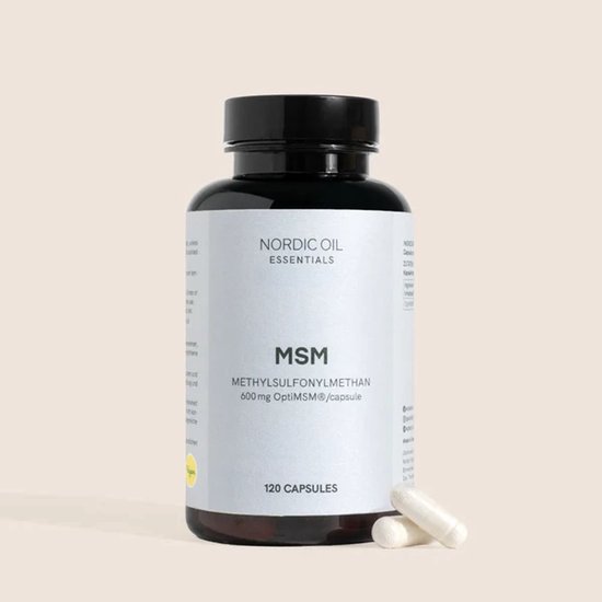 Een donkere fles met een wit etiket 'MSM' en twee witte capsules ernaast.