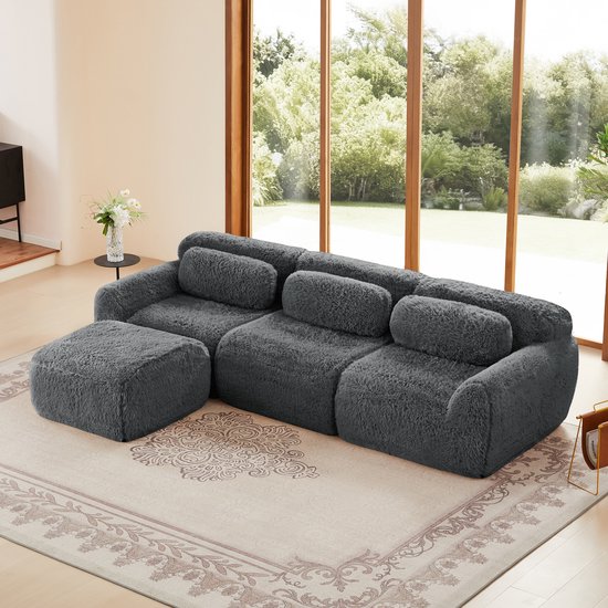 Extra large 291 cm - Canapé 3 places en L - Modulaire – Tissu Peluche – Mousse HR 32D – Excellent Support – Confortable et Durable – Stable et Antidérapant - Incluant 3 Coussins de Dossier Et 1 Pouf Déplaçable - Pour 3 Personnes - Grijs