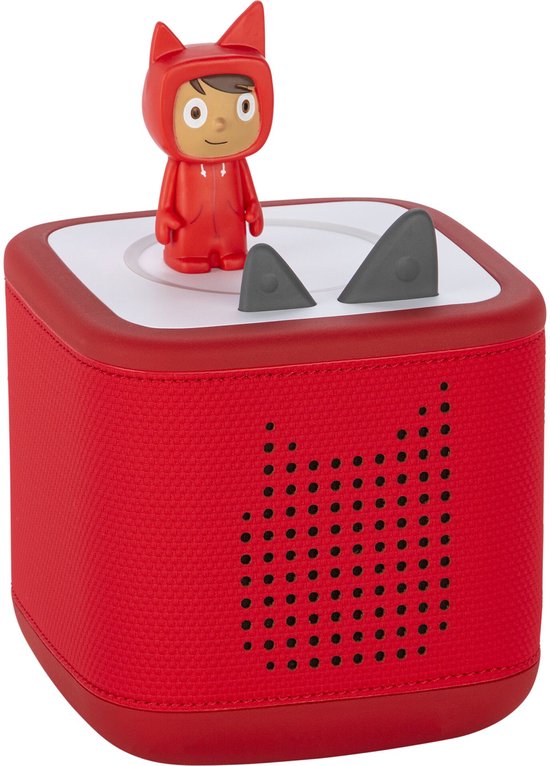 Toniebox rouge avec figurine rouge dans un costume de dragon, deux oreilles grises et une plaque blanche ronde.