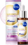 Flesje en verpakking van NIVEA Luminous630 Instant Glow Serum met pipet, en een subtiele glans.