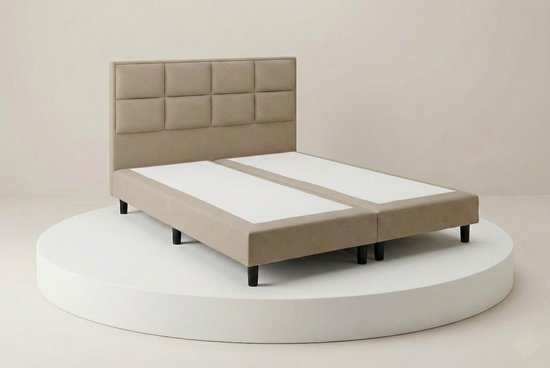 Luxe beige boxspring van 140x200 met een 8-vaks hoofdbord.