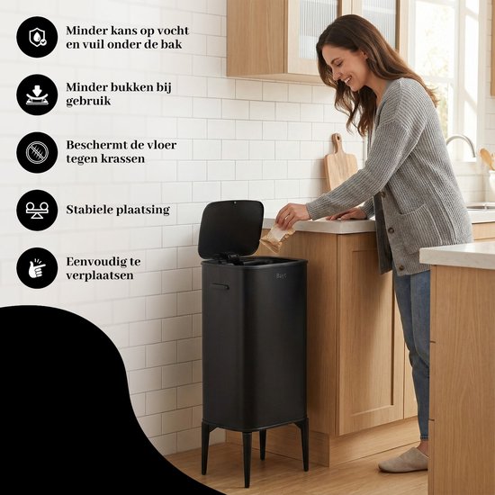 Femme en cardigan gris à côté d'une brique à déchets Bayt noire dans une cuisine.