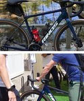 Detail van een donkerblauwe Rinos fiets met glinsterende afwerking. Een rode en grijze bidon.