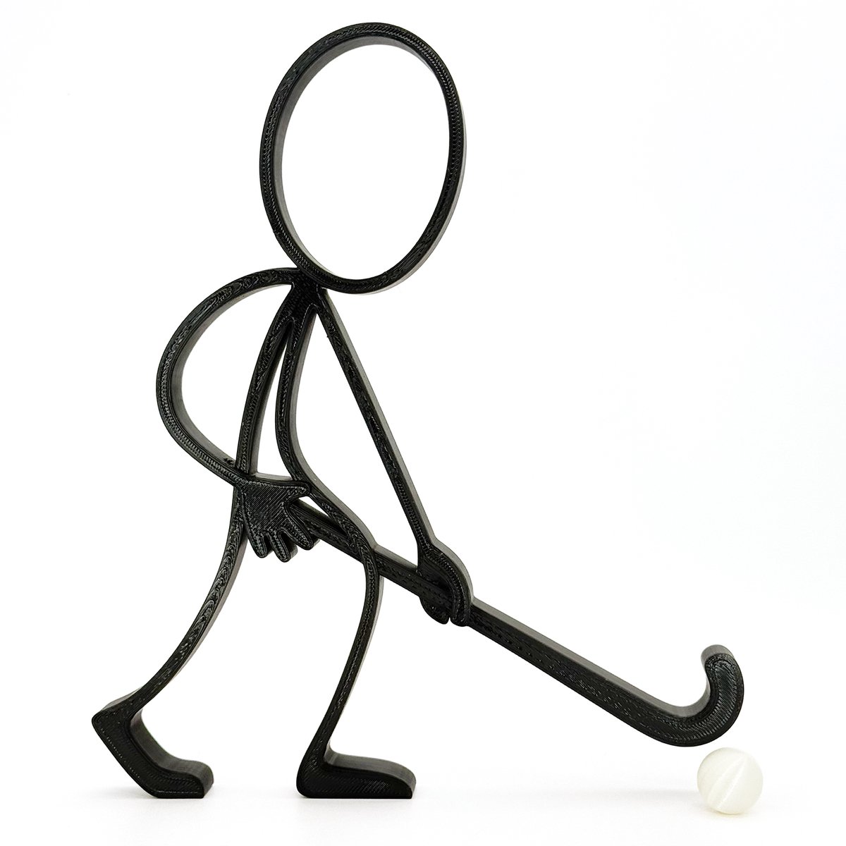 Stickyman Veldhockeyspeler - witte parelbal - zwart - 20 cm hoog