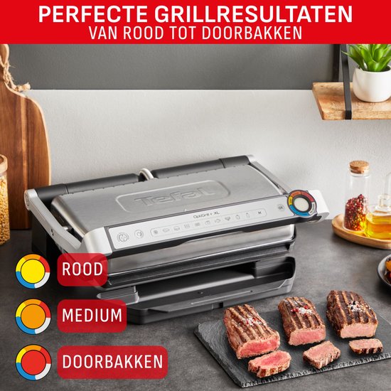Tefal contactgrill met 3 gegrilde steaks op een leisteen: rood, medium en doorbakken.