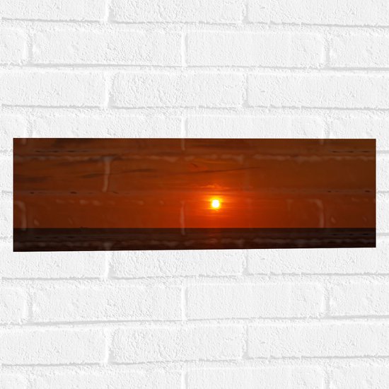 Muursticker - Roodkleurige Zonsondergang aan de Horizon bij de Oceaan - 60x20 cm Foto op Muursticker