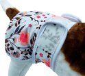 Close-up van een witte hondenluier met bloemenprint en klittenbandsluiting.