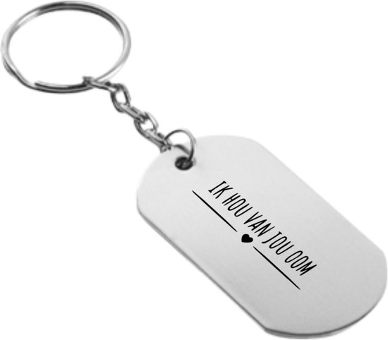 Porte-clés argenté avec pendentif ovale. Le pendentif porte le texte 'IK HOU VAN JOU OOM' et un petit cœur.