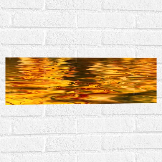 Muursticker - Gouden Gloed over Rimpelig Water - 60x20 cm Foto op Muursticker