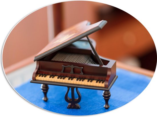 PVC Schuimplaat Ovaal - Foto van een Mini Piano - 56x42 cm Foto op Ovaal (Met Ophangsysteem)