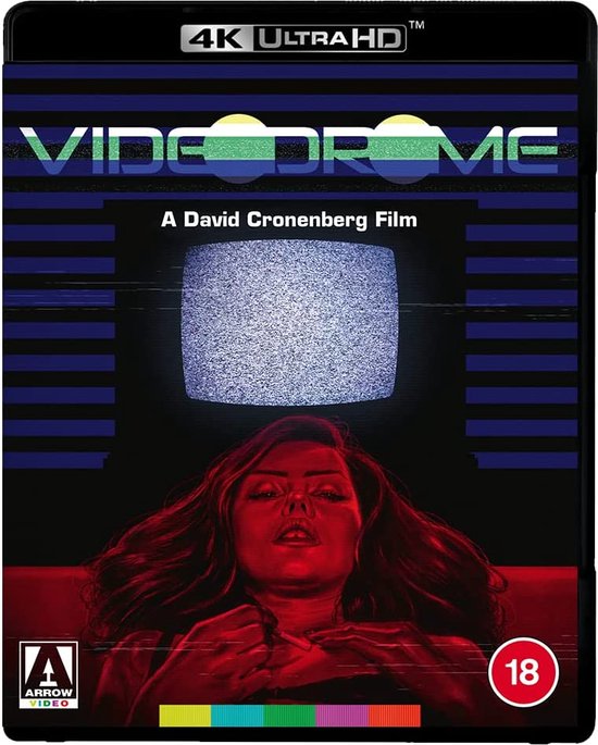 De cover toont een vrouw met lang, donker haar, kijkend naar een statische tv. Het woord 'VIDEODROME' is bovenaan.