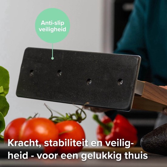 Magneetblok van walnoothout met RVS voet, omgekeerd gehouden. Text: "Kracht, stabiliteit en veiligheid - voor een gelukkig thuis".