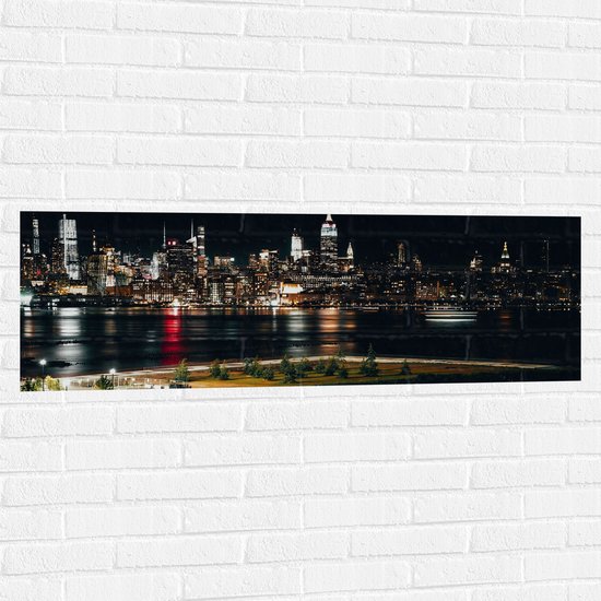 Muursticker - Skyline in New York in de Nacht - 120x40 cm Foto op Muursticker